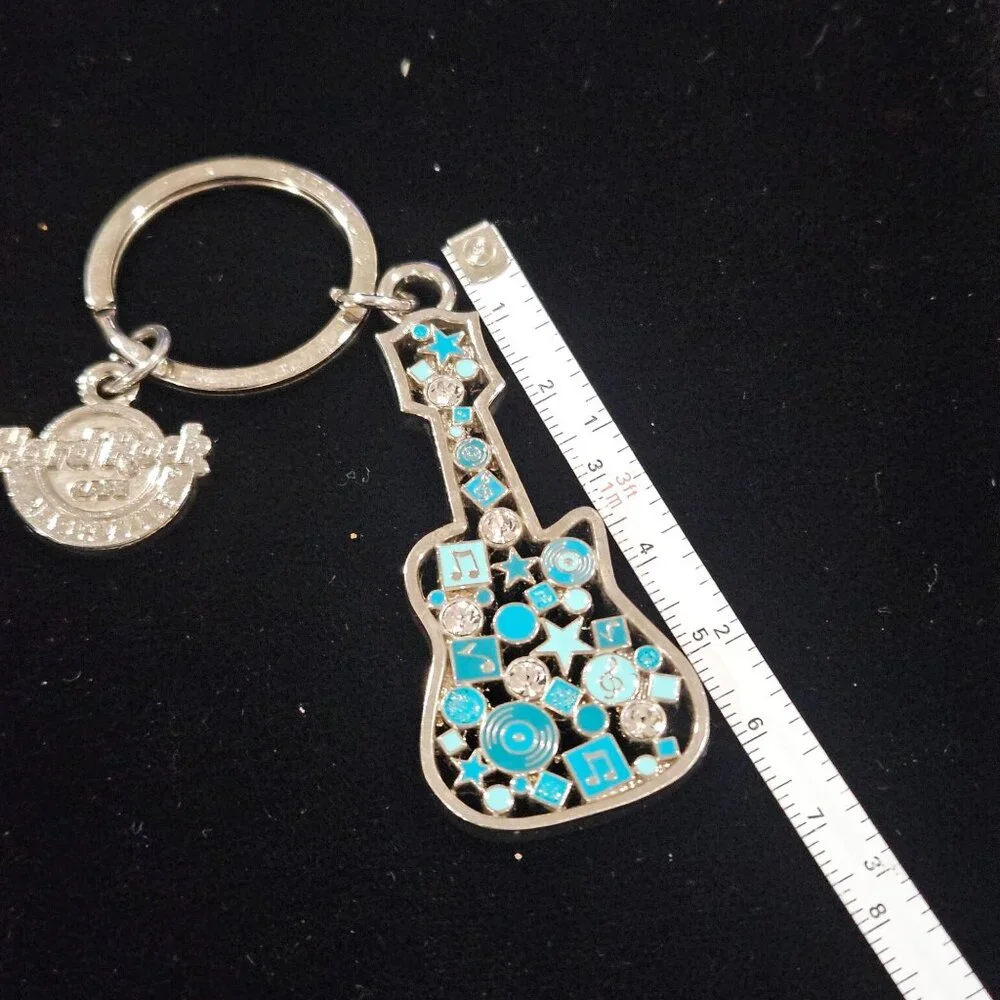 Hard Rock Cafe Nashville Guitar Keychain With Blue & Silver Musical Notes Design